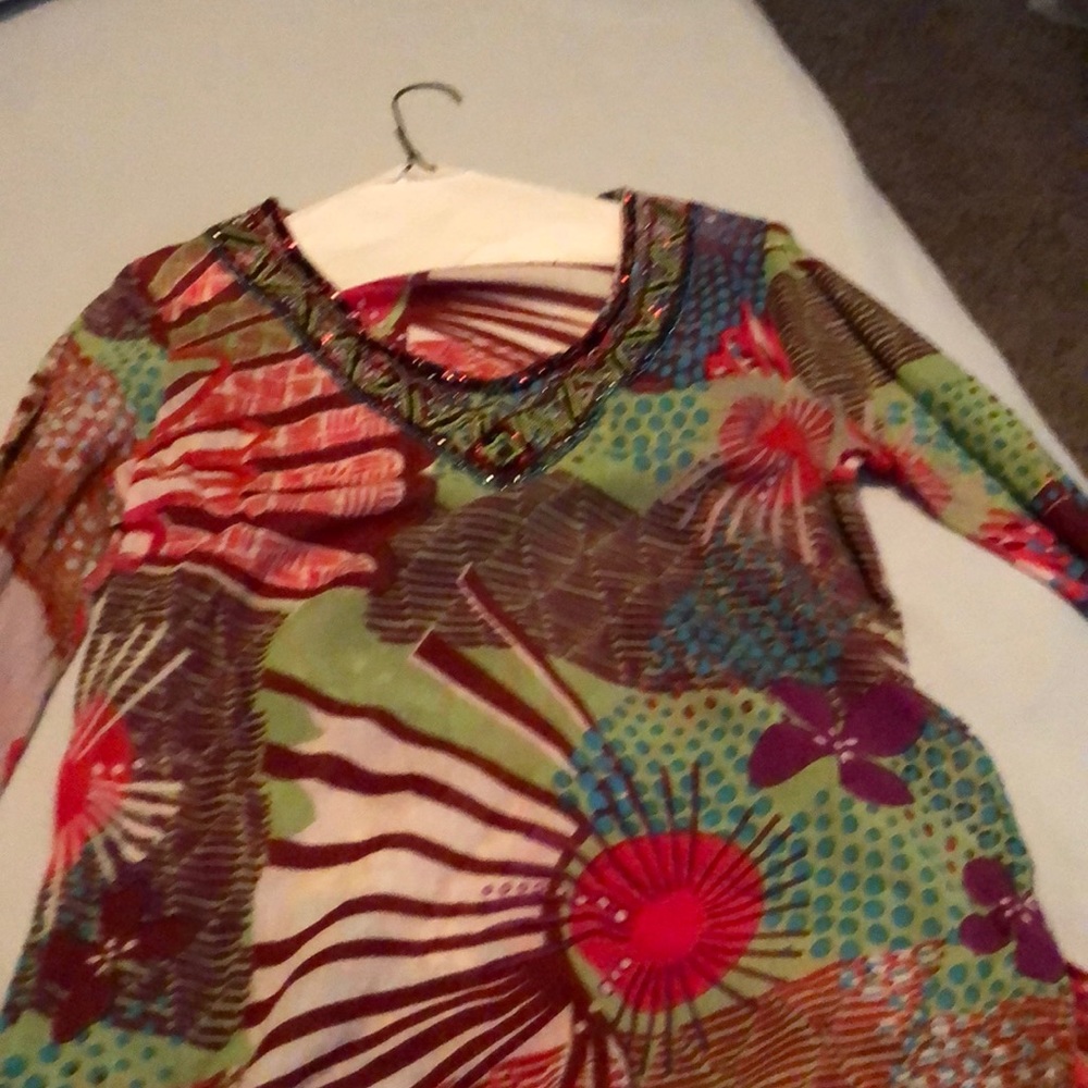 Tunic. Long sleeved. Cute as a swim cover up!